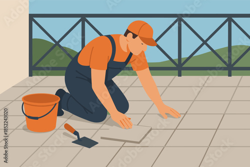 Adult male tiling patio floor with tools on sunny day