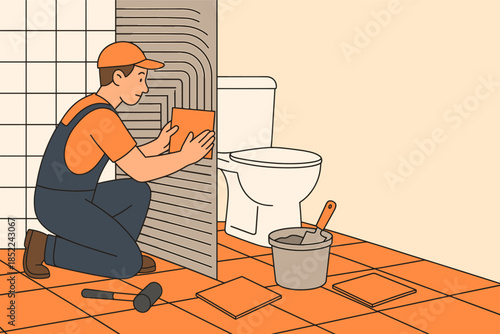 Male tiler installing bathroom wall tiles with tools