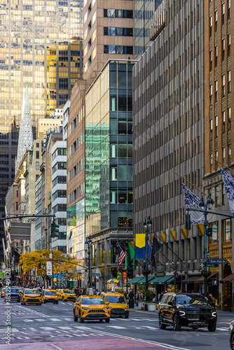 Photos Busy Fifth Avenue traffic with yellow taxis in Midtown Manhattan New York City