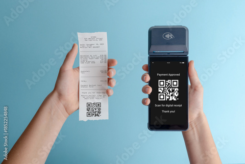 Paper receipt held next to payment terminal showing QR code confirmation, concept of digital receipt, cashless payment, and modern retail technology