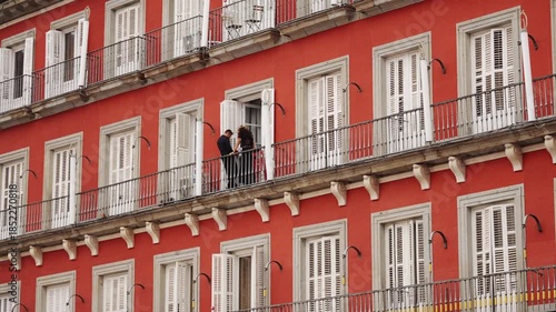 Couple on Balcony in Plaza Mayor Madrid