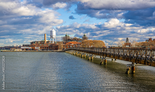 Photos Ellis Island historic complex and service bridge over New York Harbor, NYC