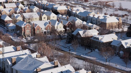 Aerial view of  suburban family houses at winter with snow on the roofs