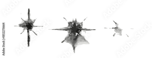 Close-up of three distinct bullet holes or impact cracks in a transparent glass surface, showing shattered patterns and damage.