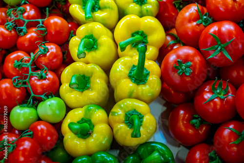 Tri colour pepper selling in super market. Placed with peppers in a market in Antalya Turkey. A top view close up of yellow and red bell peppers. The bell pepper is the fruit of plants in the Grossum 