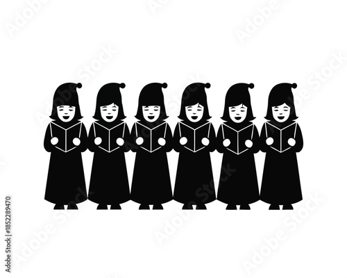 Group of children dressed as Christmas carolers singing from books