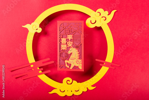 red pocket for Chinese New Year of the Horse with tradition Chinese decorations translation of the Chinese characters are Safe and Happy no logo no trademark