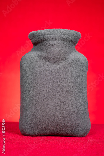 a small hot water bag on red at vertical composition