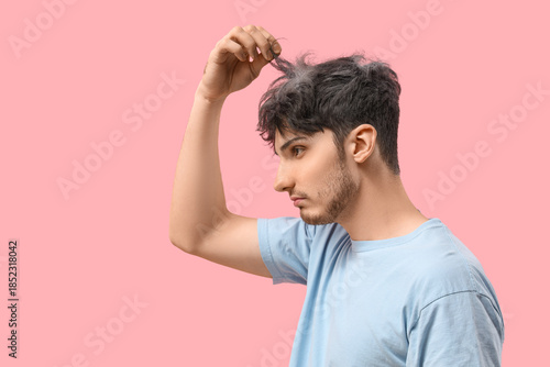 Young man with graying hair...