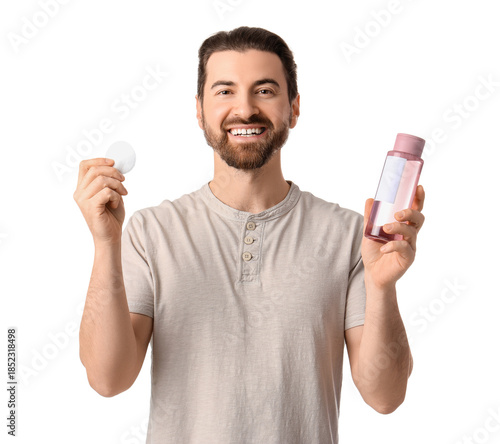 Handsome man with bottle of...