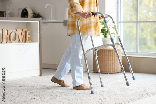 Senior woman using walker i...