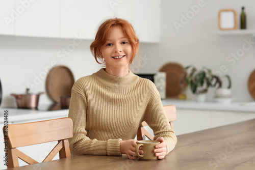 Teenage redhead girl with c...