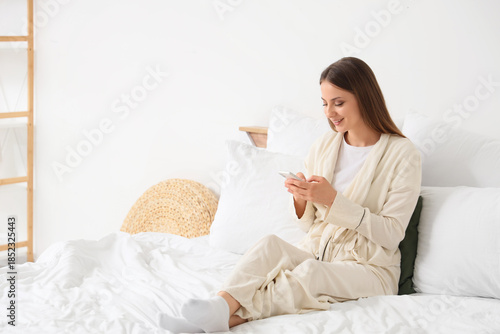 Young woman using mobile ph...