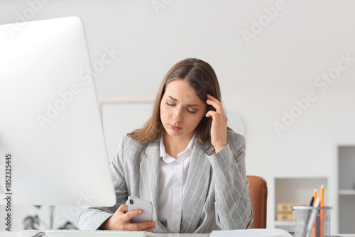 Thoughtful businesswoman us...