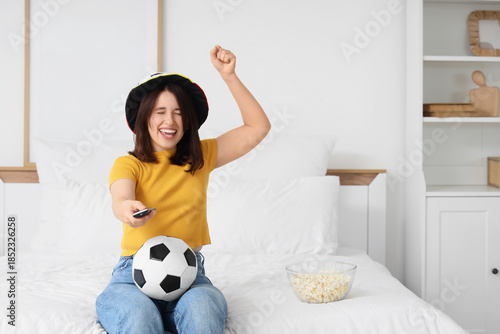 Happy young woman with TV r...