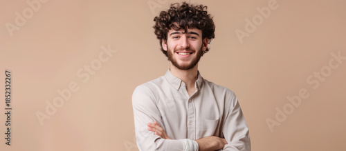 Smiling Confident Man: A charming individual with a warm smile, exuding confidence, and showcasing a friendly demeanor. The backdrop is a neutral tone that complements his skin tone.