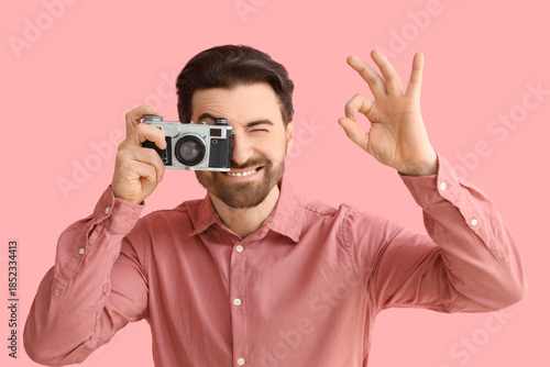 Young man with photo camera...