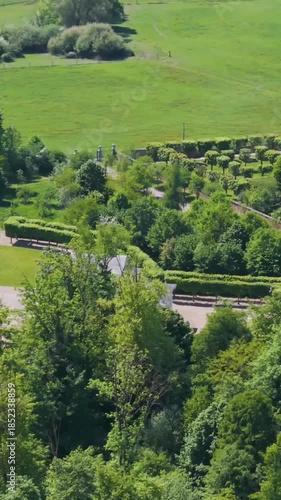 green areas surrounding château seneffe including dry ponds well maintained parks fields create picturesque setting for to left right pans aerial of 