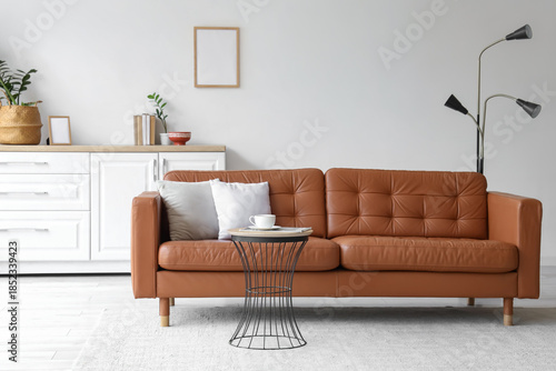 Brown leather sofa and coff...