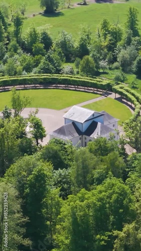 château seneffe along surrounding green areas dry ponds well maintained parks fields enhance estate's to revealing left right backside pans aerial of 