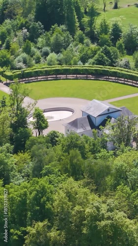 château seneffe surrounded by green trees overlooking fields nearby water bodies add scenic landscape to left right pans aerial of de belgium 