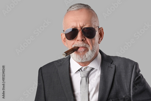 Old businessman in sunglass...