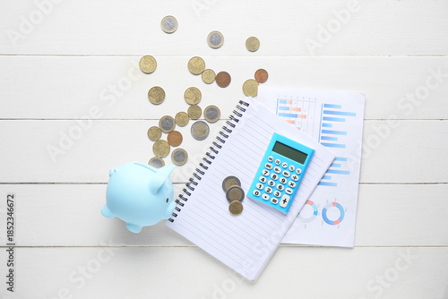 Piggy bank with calculator,...