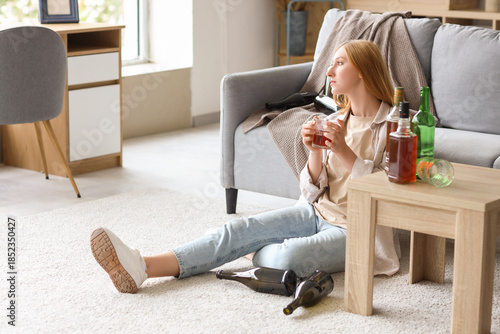 Young woman drinking alcoho...