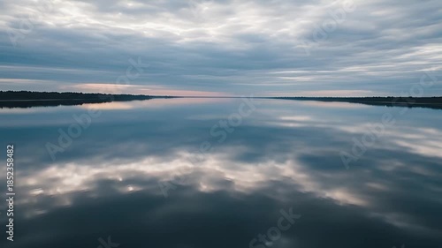 Aerial River Reflecting Cloudy Sky Like Mirror