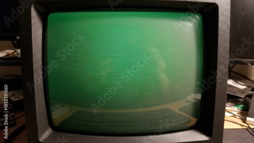 Retro computer monitor displaying green text and lines