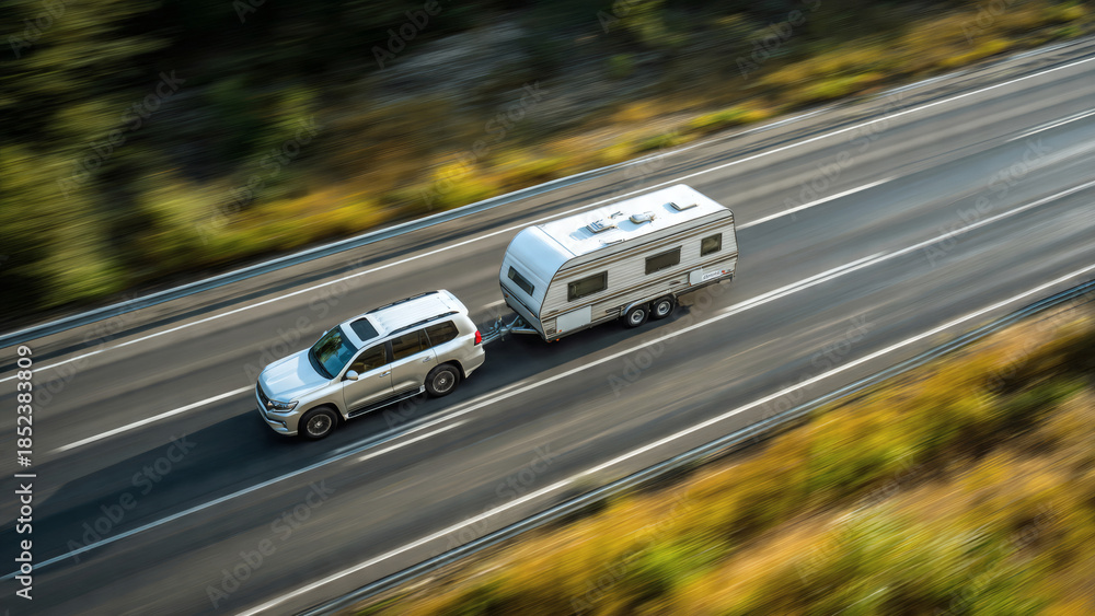 Fototapeta premium Car Towing Caravan Highway Road Travel Vacation Motion Aerial Landscape Camping Trip