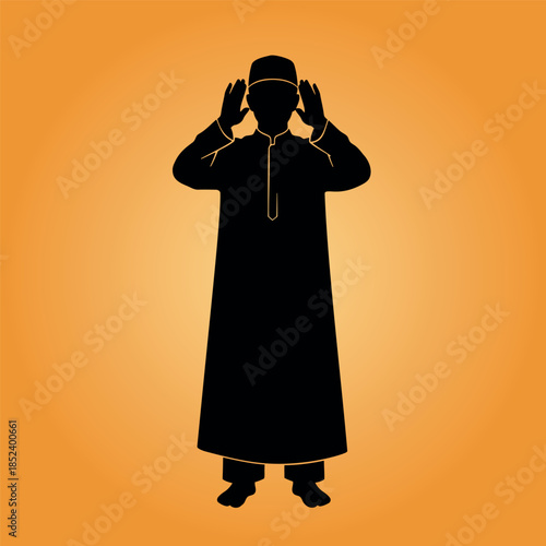 A man in traditional attire praying during Ramadan, silhouetted against a warm orange background, serene atmosphere, and peaceful surroundings.