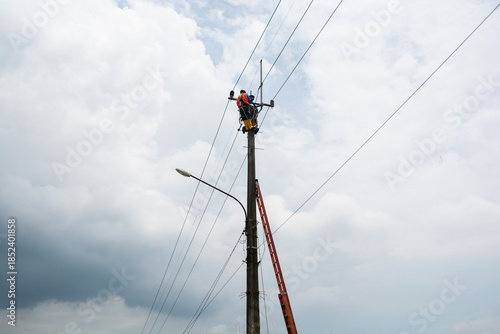Electrical engineers work on high towers