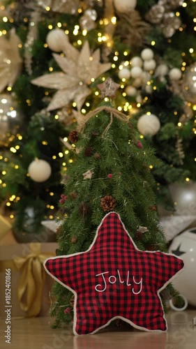 Christmas tree decorated with lights and stuffed animals in a house, vertical format
