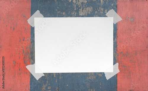 Blank Paper Sheet with Adhesive Tape on Wooden Background. File with Clipping Path.