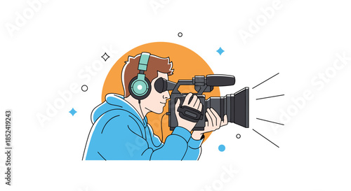 A professional male cameraman wearing headphones and looking through a video camera while filming an event or movie production.