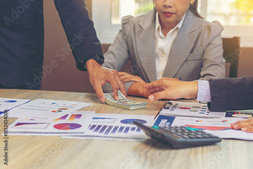 Businessman paid money banknotes and making decision for business investment. Selected focus