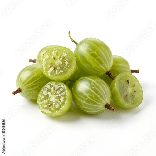 A pile of green gooseberries, some halved to show their interior, on a plain white background with soft shadows underneath.