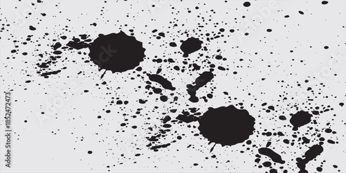 Abstract grunge texture with black speckles and scattered dots on a white background, great for artistic designs.