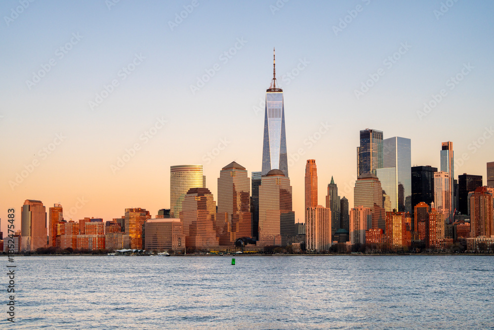 Obraz premium Manhattan skyscrapers with blue tones in New York NYC. Manhattan cityscape photography in New York NYC. Manhattan panorama with urban towers in New York NYC.