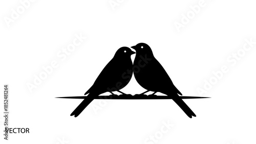 Two black birds silhouette perched on a thin line facing each other.