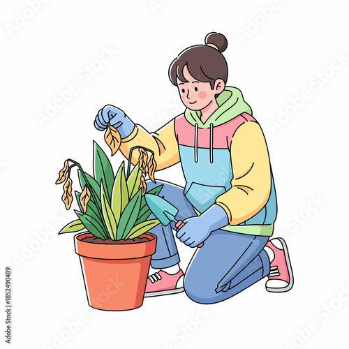 Young woman caring for her indoor potted plant, pruning dry leaves and nurturing greenery with gardening tools