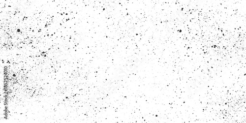 Black ink splatters and dots on a white textured background grunge