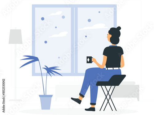 Woman sitting on chair holding coffee cup by window with plant and lamp