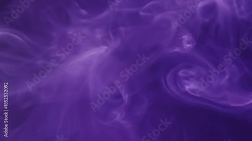 Abstract image of swirling, ethereal violet smoke with soft highlights and a blurred focus