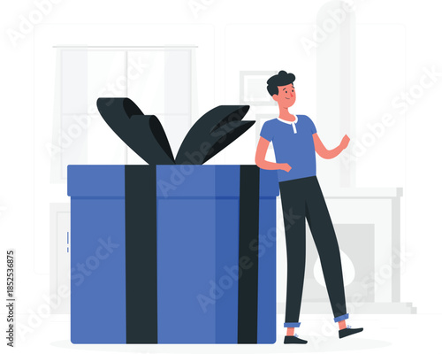 Man standing next to large blue gift box with black ribbon