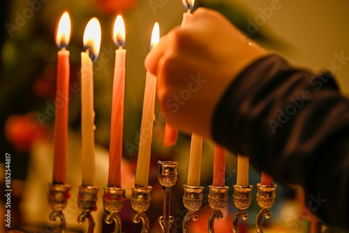 High resolution close up image of the celebration of the Jewish holiday of Hanukkah- lighting the full 8 candles of the Menorah- Israel