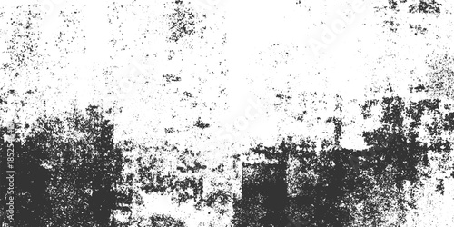 Black and white speckled grunge texture with rough edges and distressed surface