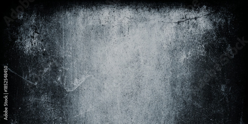 A distressed weathered gray surface with a rough texture and dark edges suggests age and decay