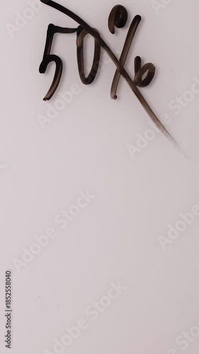 How to write and erase numbers to indicate discounts. Watch as different percentages are changed clearly. Perfect for sales and special offers.